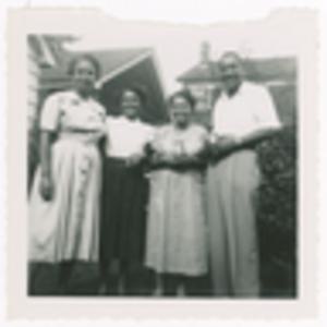 Photograph of Augusta Baker and Three Unidentified People