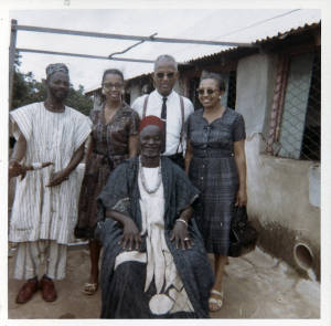 Photograph, n.d., (Ghana), of Joseph A. De Laine, Sr., Mattie De Laine, Ophelia De Laine, and a tribal chieftan