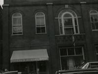 Men standing on Main Street, Farmville, Va., June 1962