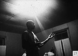 Man Gesturing in Room