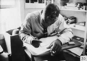 Man Smoking and Writing