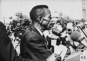 Man Speaking into Microphones