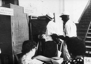 Men Outside Voting Booths