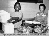 Volunteers Prepare Plates at Thanksgiving Dinner